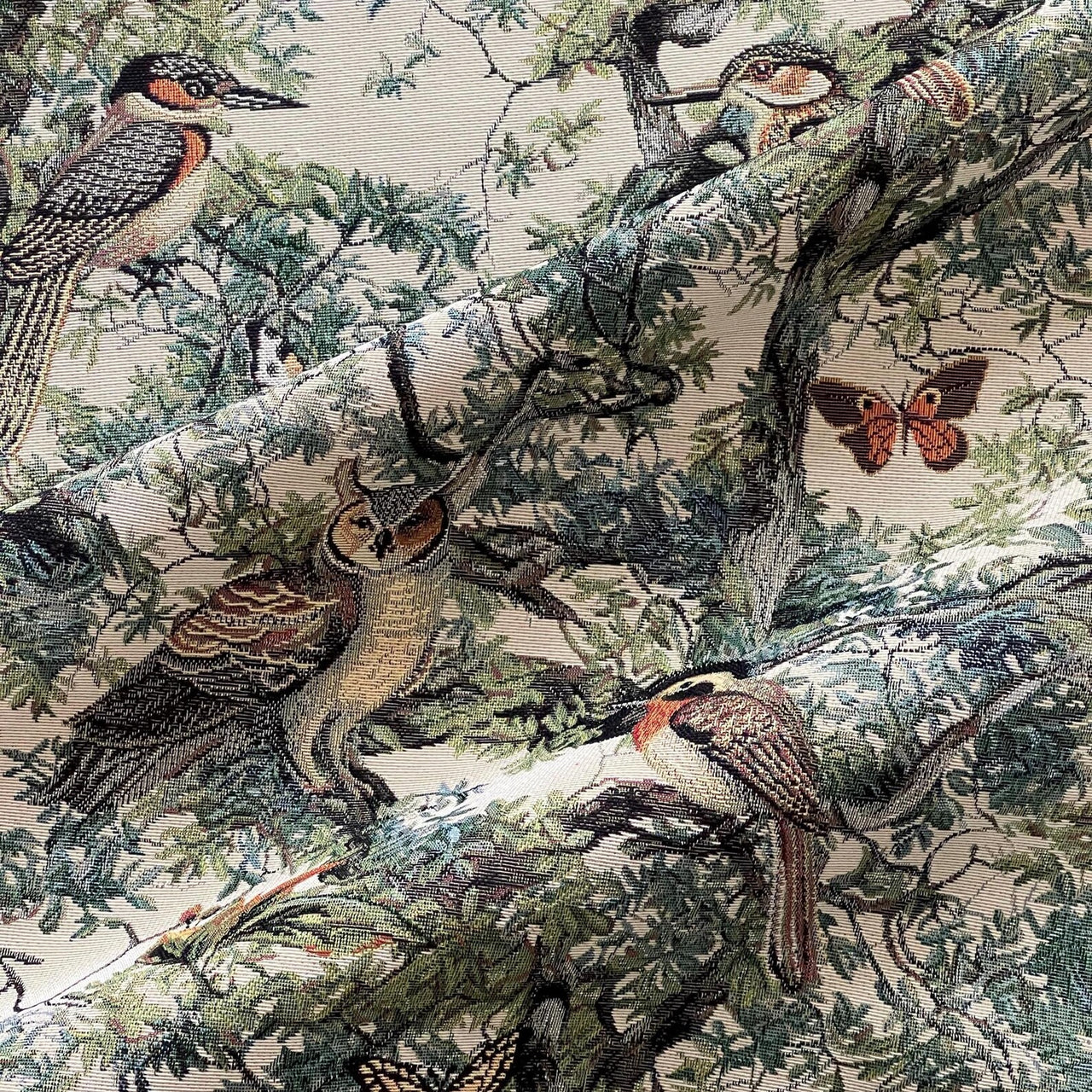 Classic nature-patterned tapestry showing branches filled with birds.