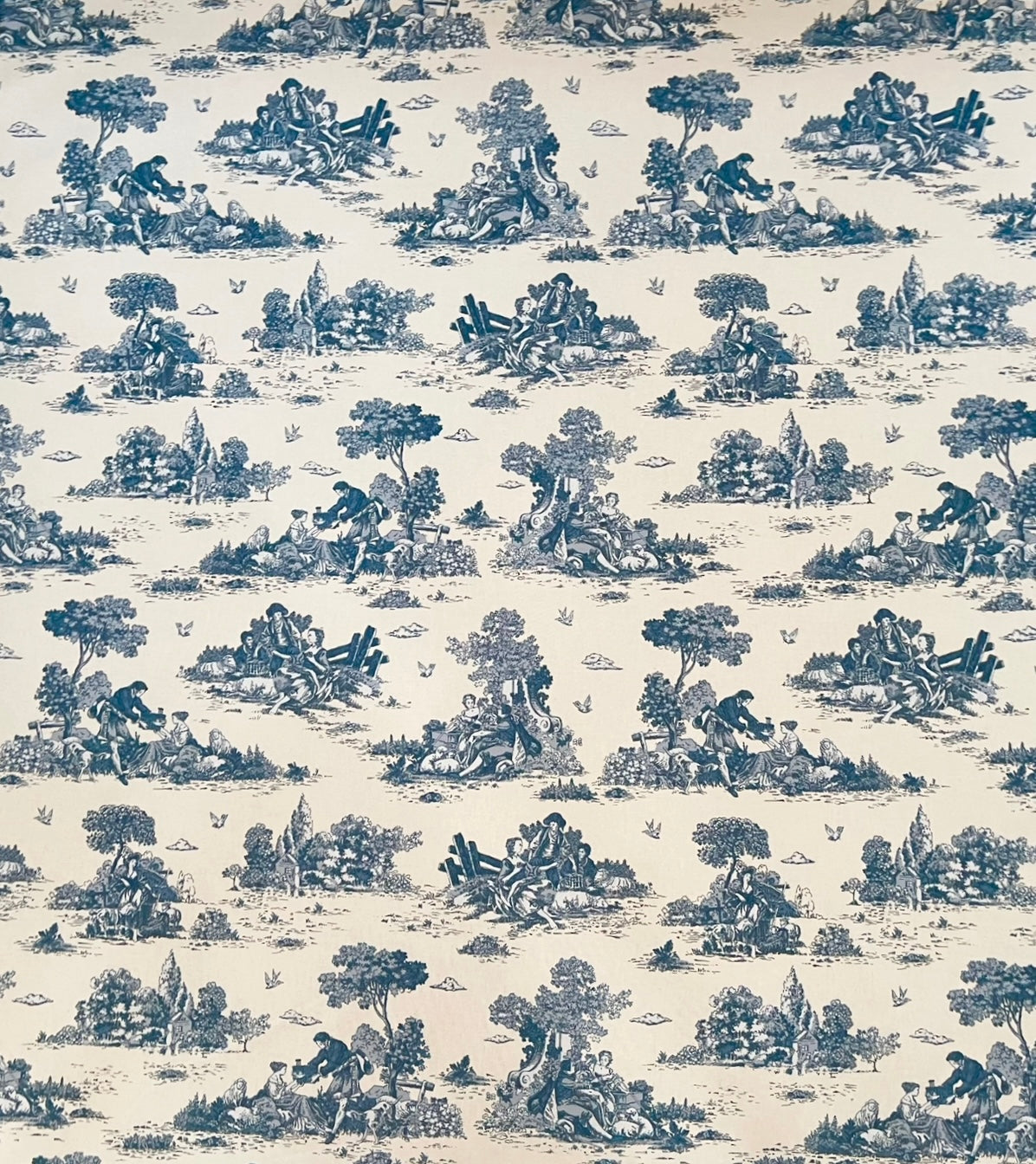 Romantic countryside-themed upholstery fabric with birds and trees