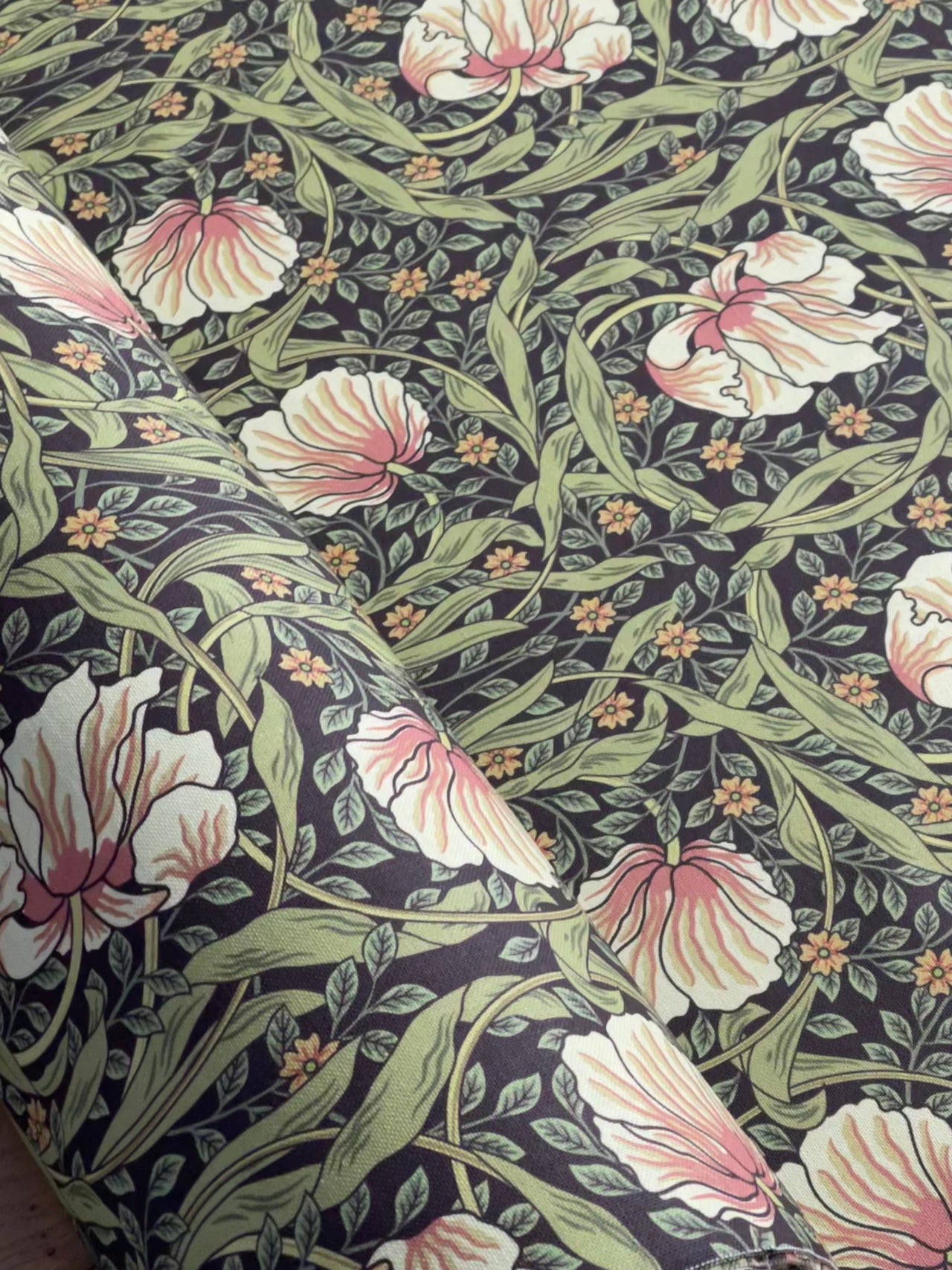 Heritage William Morris fabric design with tulip and leaf motifs.