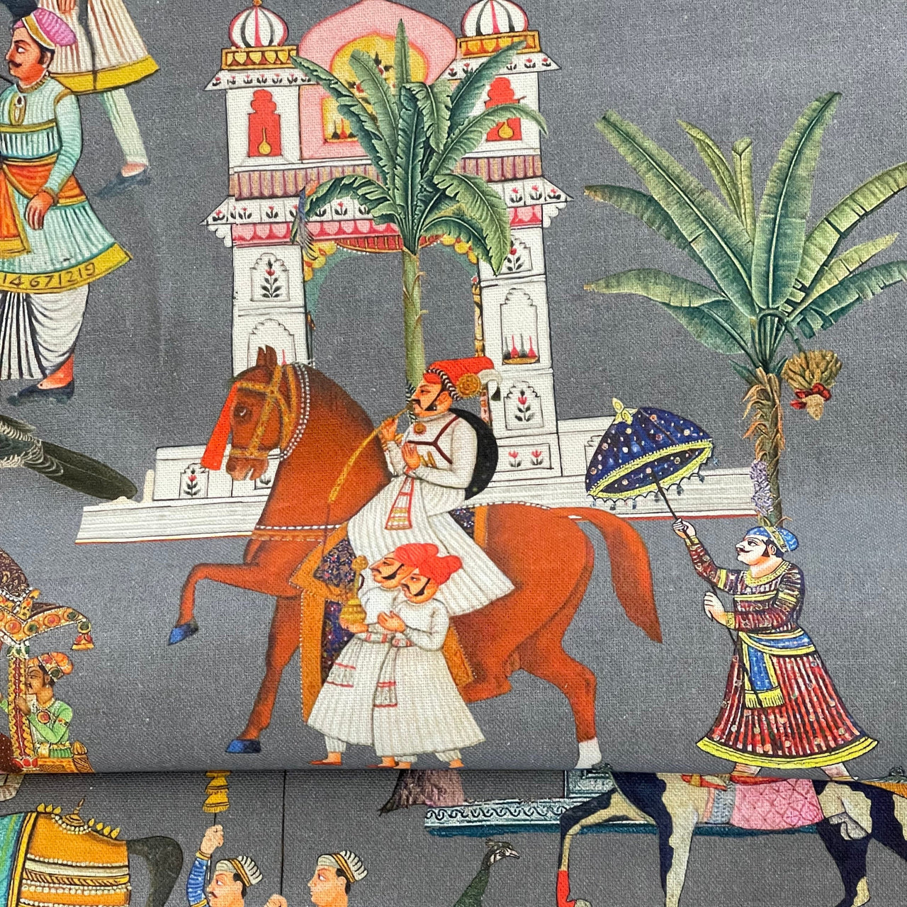 Home decor fabric with colorful palace and parade motifs on grey background