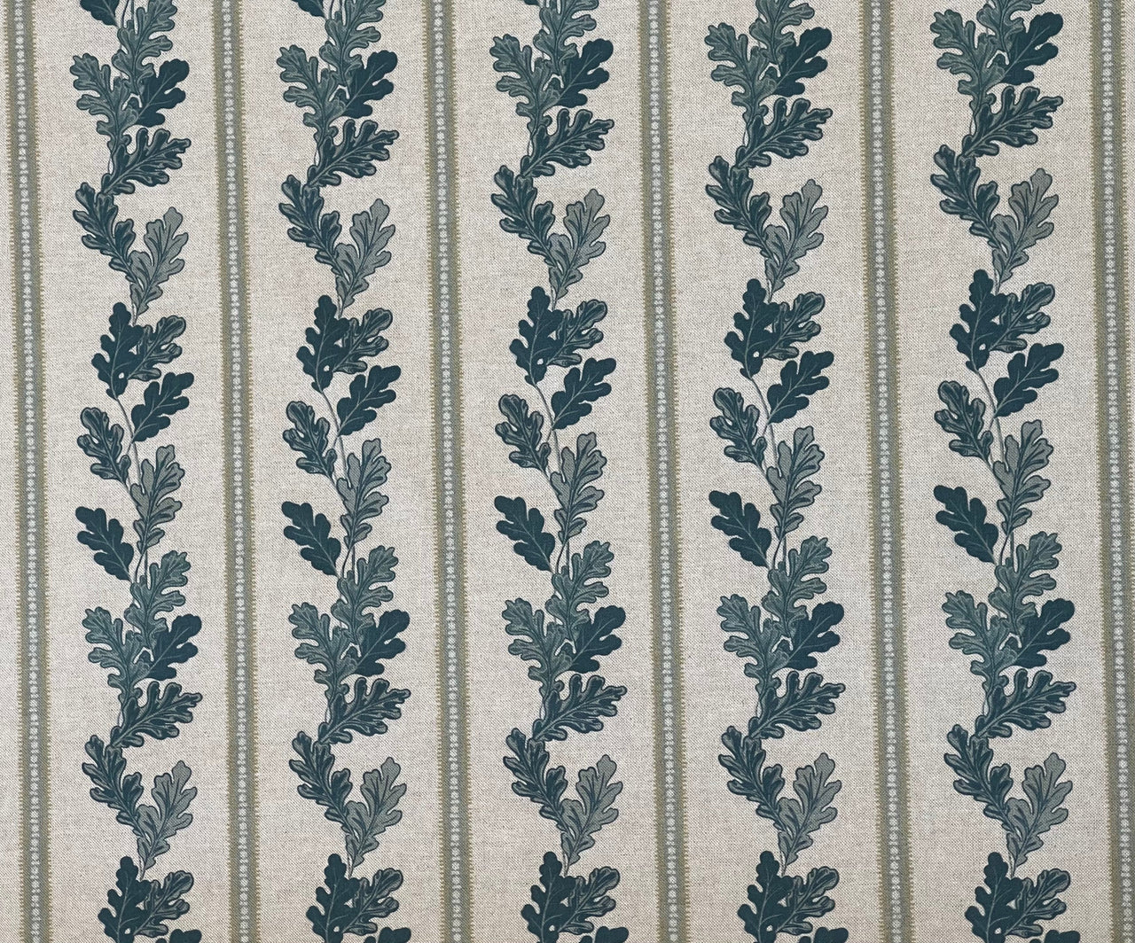 Home furnishing fabric featuring beige oak leaves and subtle stripes