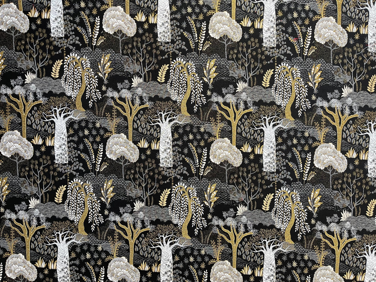 Upholstery fabric for chairs with black and gold design.