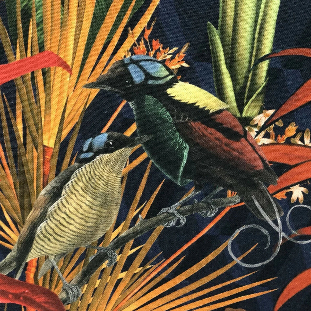 Fabric showcasing Bird of Paradise and leafy greens