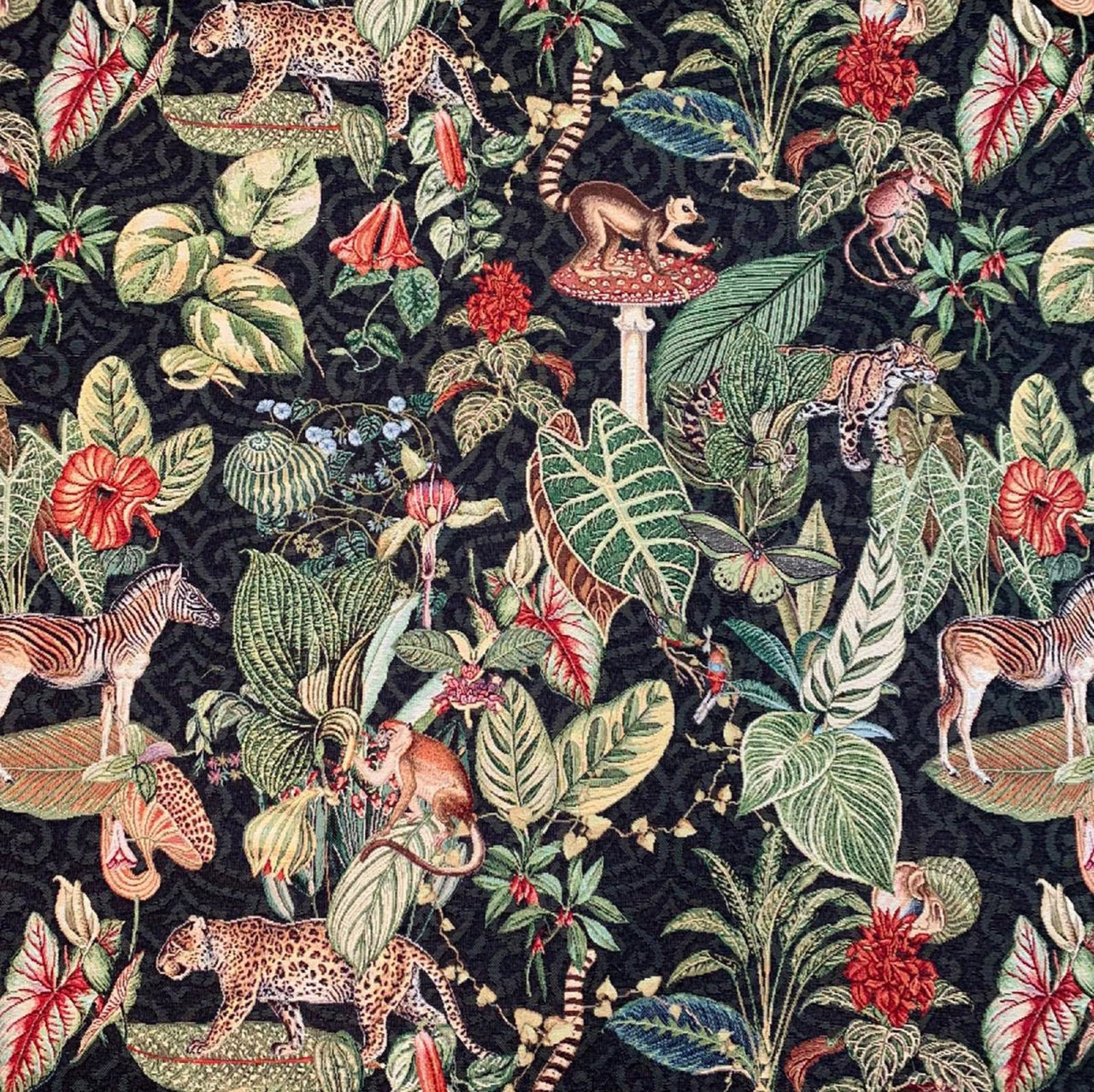 Black tapestry fabric with animal and plant pattern.