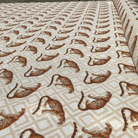 Thumbnail for Patterned fabric with brown leopards on a beige background