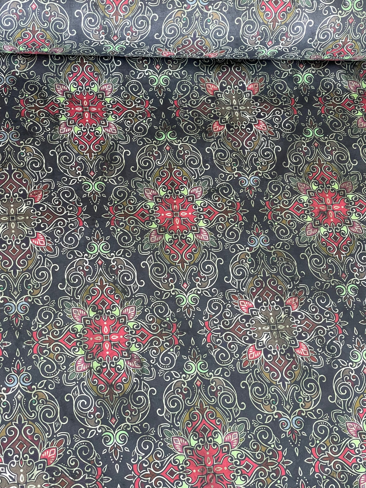 Persian-inspired cotton textile in black with ornamental medallions