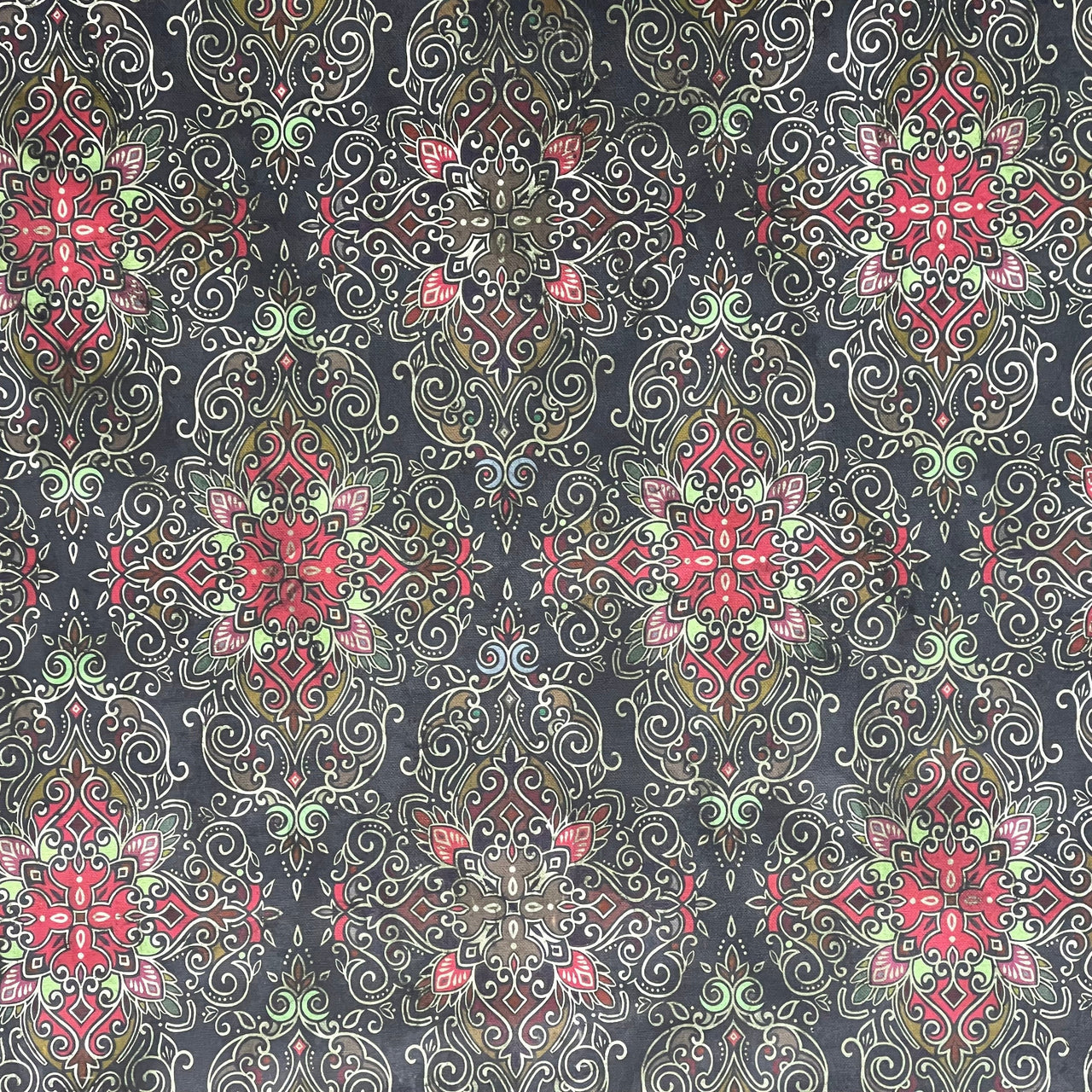 Organic cotton fabric with red and green mandala-style repeats