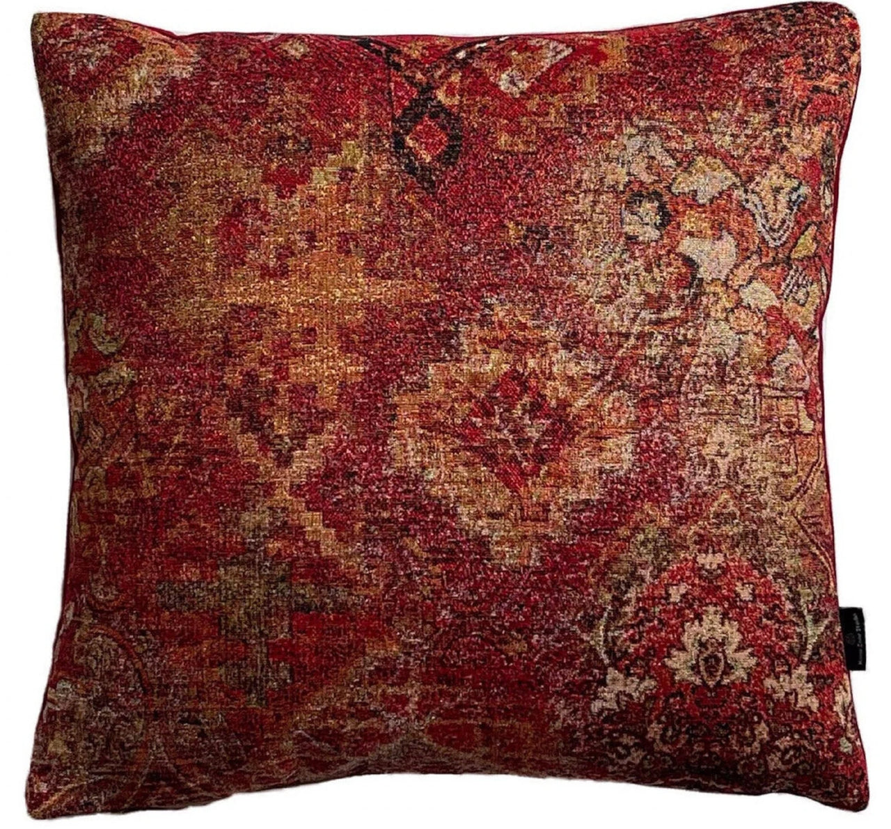 Earthy red kilim cushion in warm lighting
