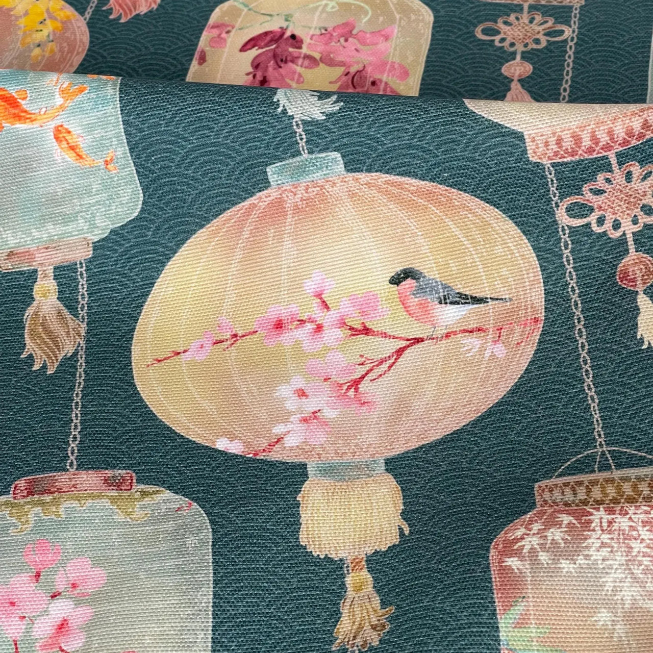 Green chinoiserie fabric with birds and blossoms