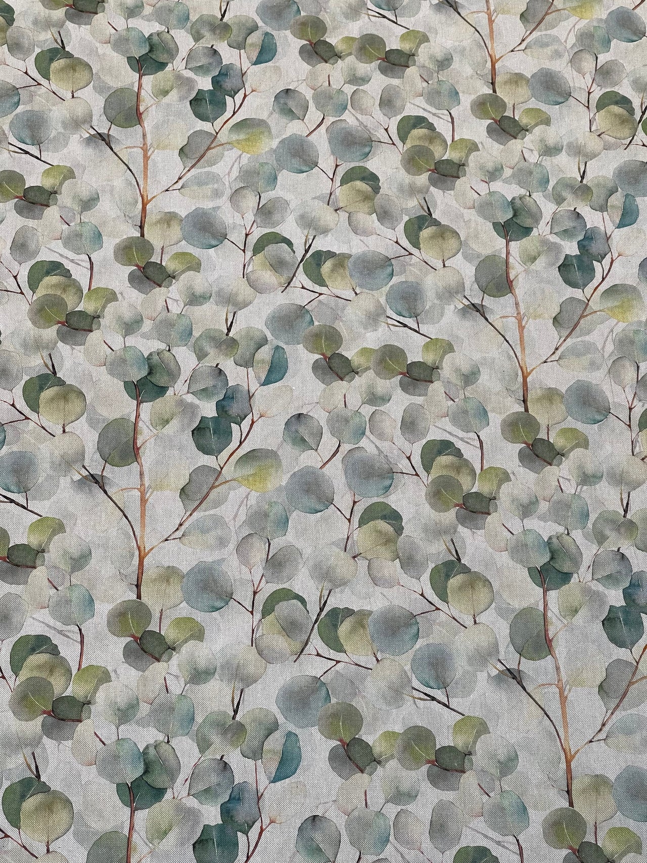 Textile with eucalyptus illustration in subtle hues