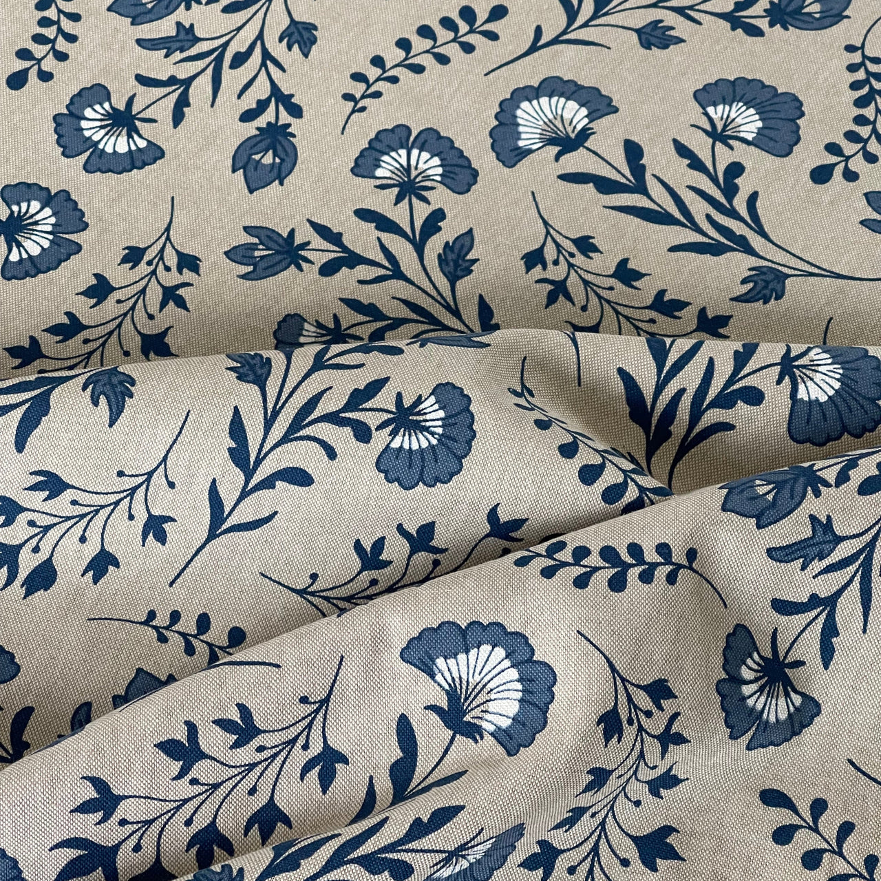 Dutch floral fabric with blue pottery-inspired design

