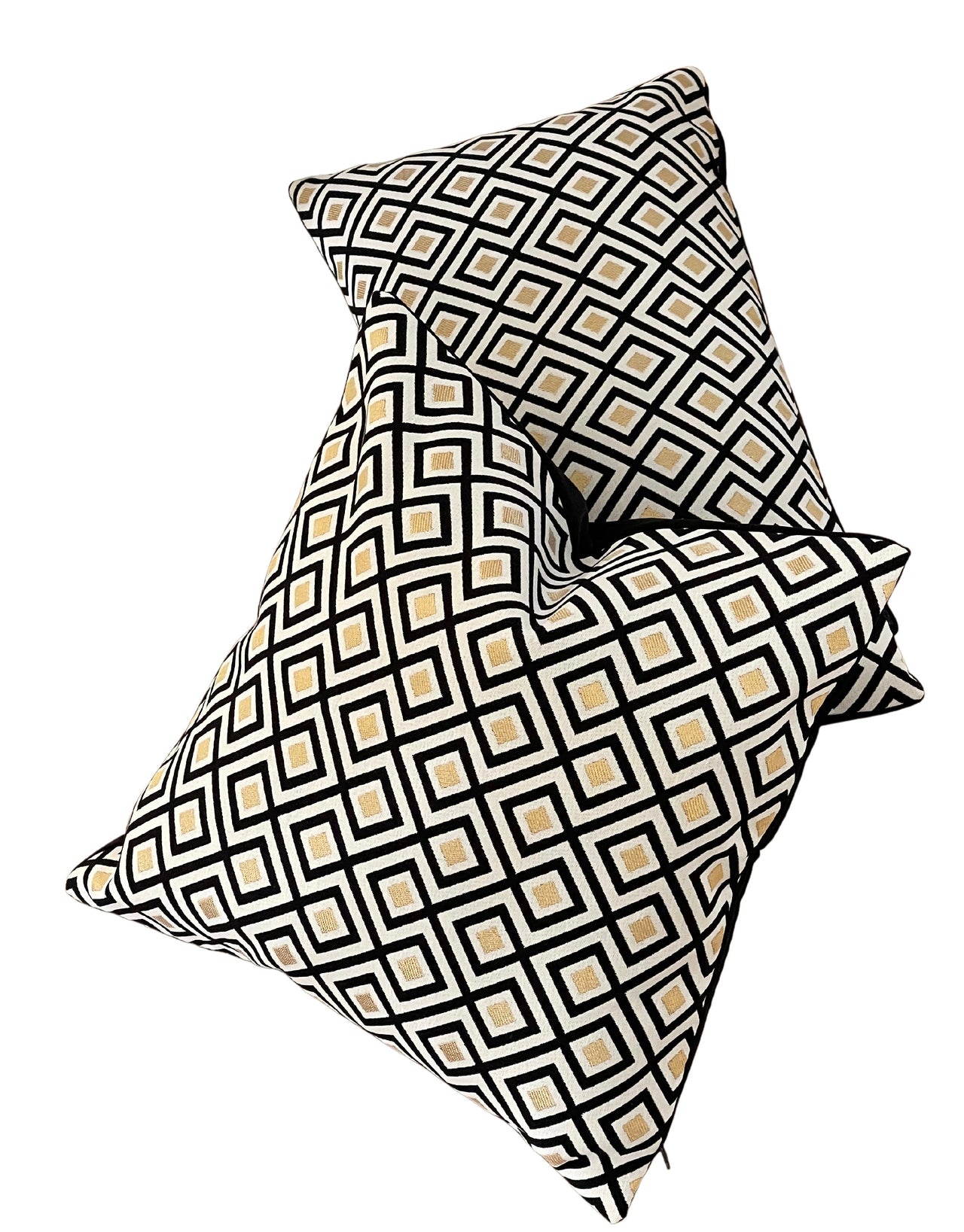 Bold black and gold geometric cushion cover.