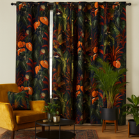 Thumbnail for Living room with tropical-themed curtains made from Deep Jungle cotton fabric featuring vibrant orange Anthurium flowers, passion flowers, lush green foliage, and exotic birds. The room includes a mustard velvet armchair with a matching jungle-patterned cushion, potted palms, and a dark round coffee table on a patterned rug