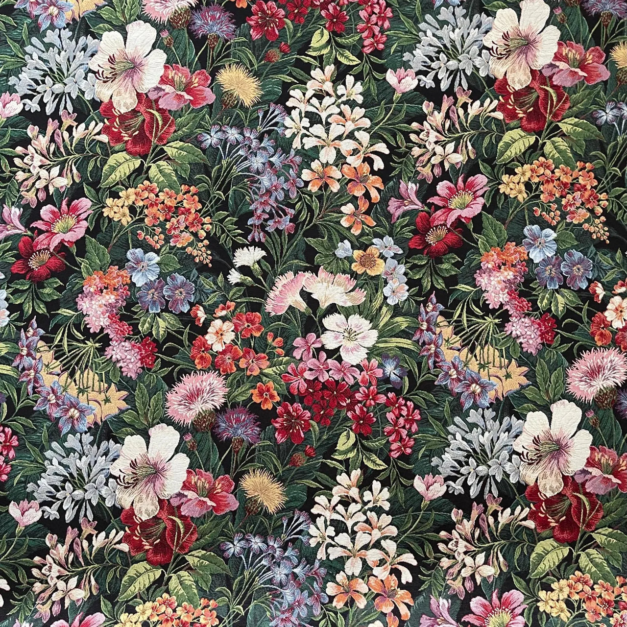Heavyweight tapestry fabric showing detailed botanical blooms in jewel tones.