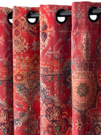 Thumbnail for Red patterned curtains with grommets on a black rod.