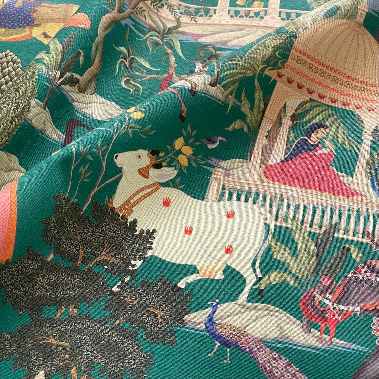 Indian palace scene captured in textile art on 100% cotton fabric with jungle flora and fauna.
