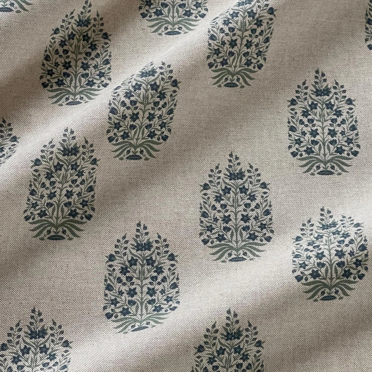 Blue floral upholstery fabric with traditional folk pattern detail