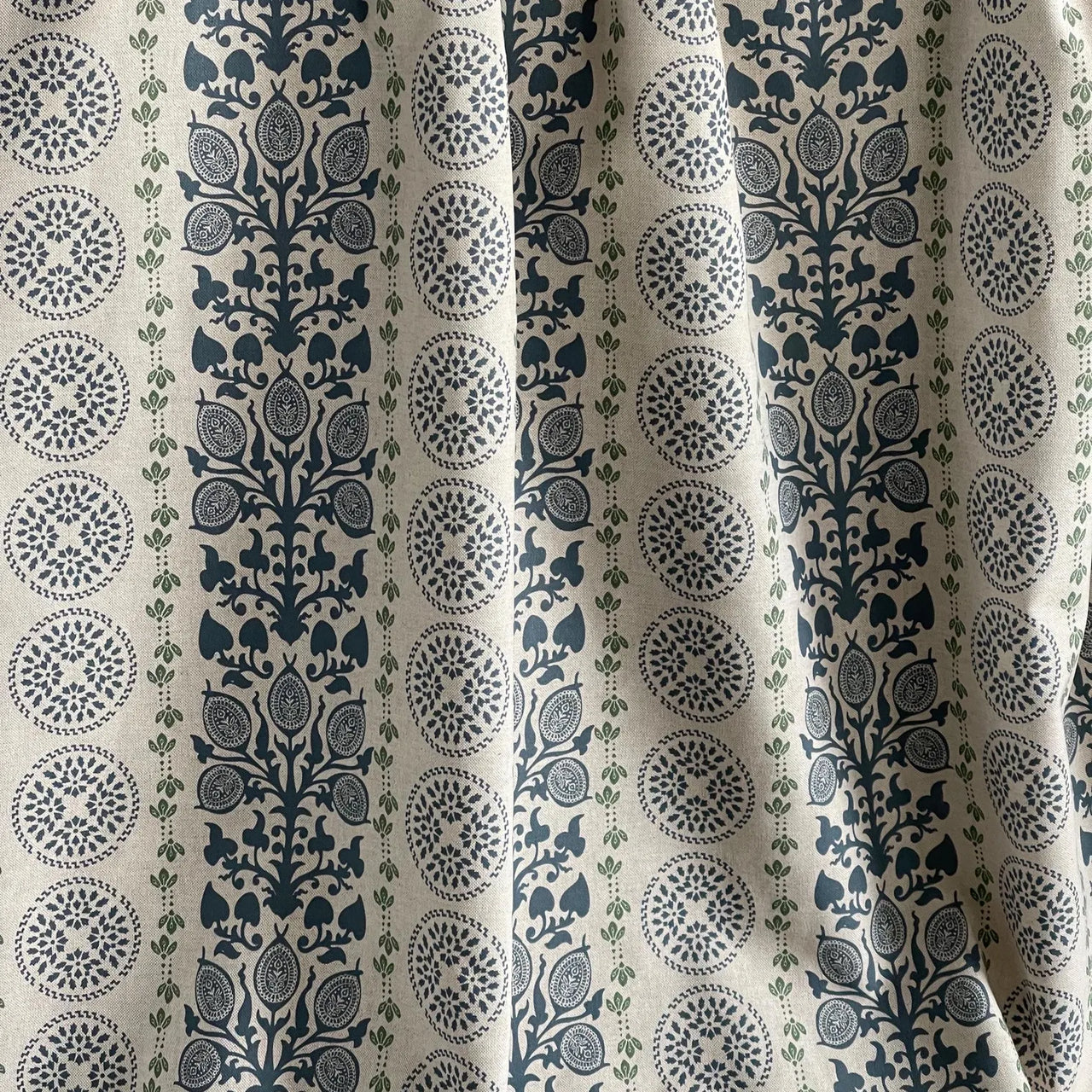 Navy and green botanical fabric ideal for curtains and Roman blinds