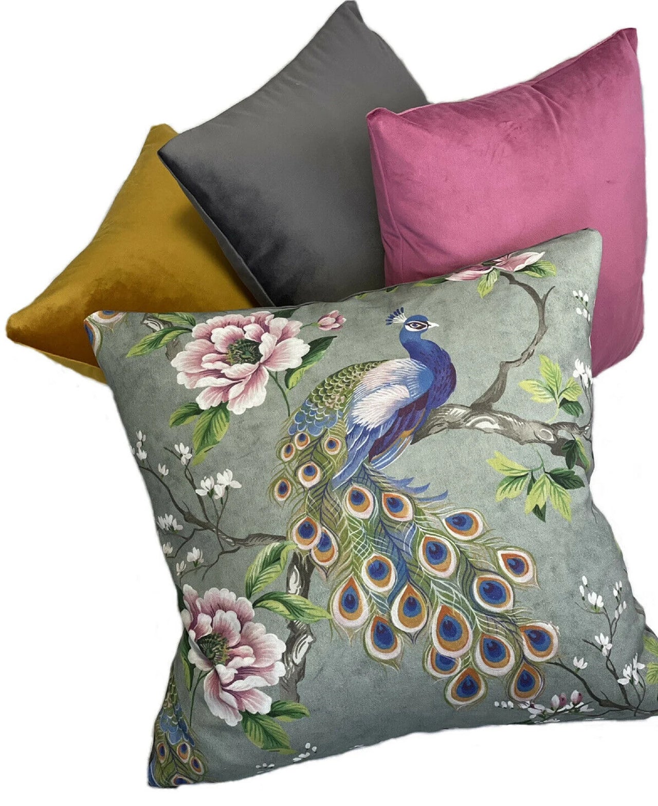Peacock-themed throw pillow with velvet accents.