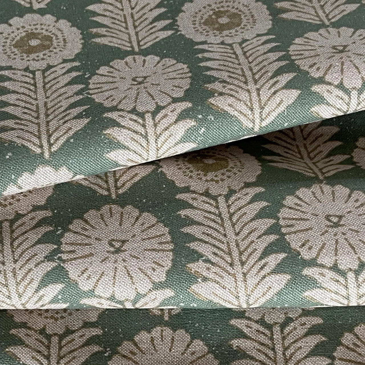 Apple green floral fabric with balanced repeating botanical design