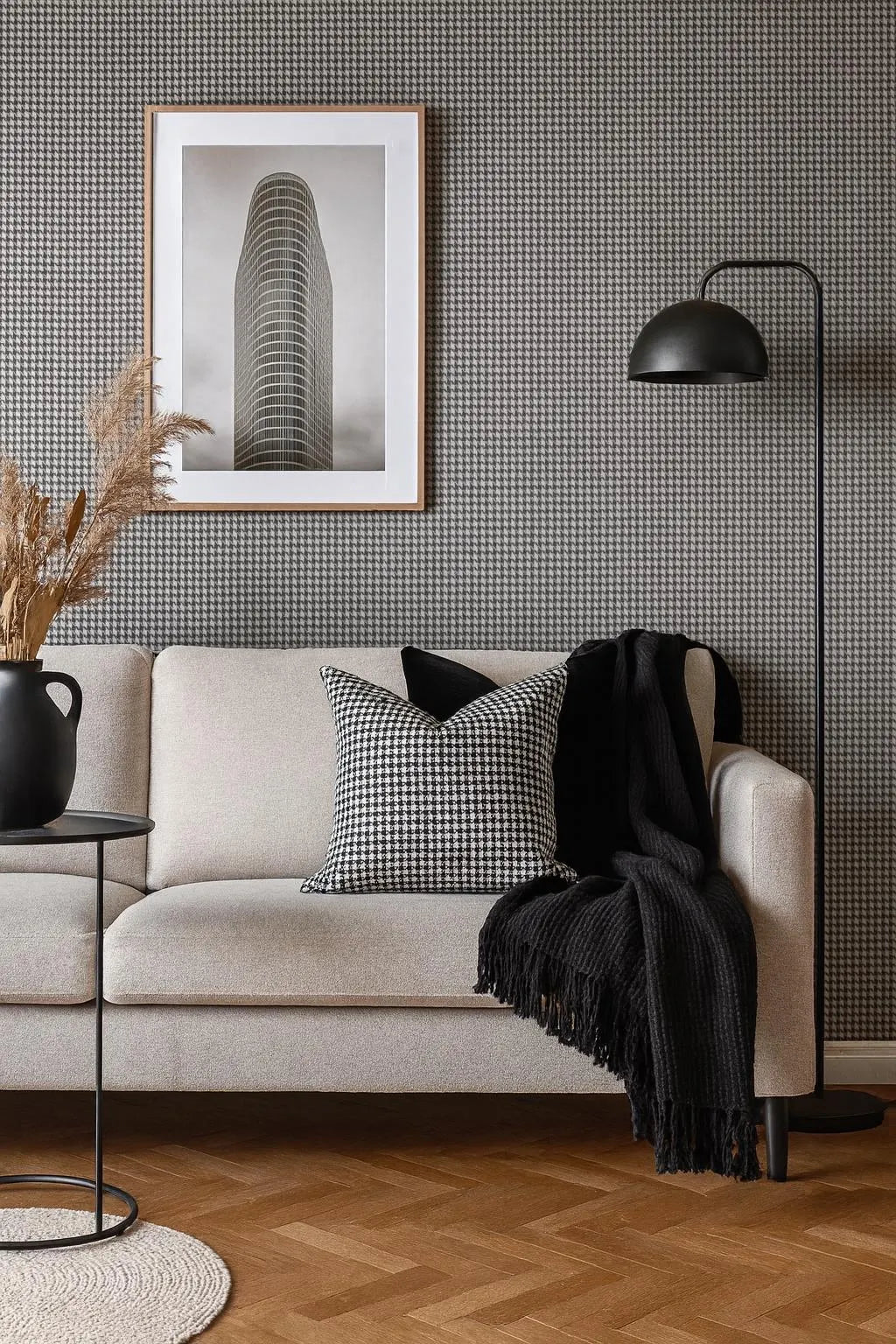 Modern living room scene with houndstooth accent pillow and neutral décor.