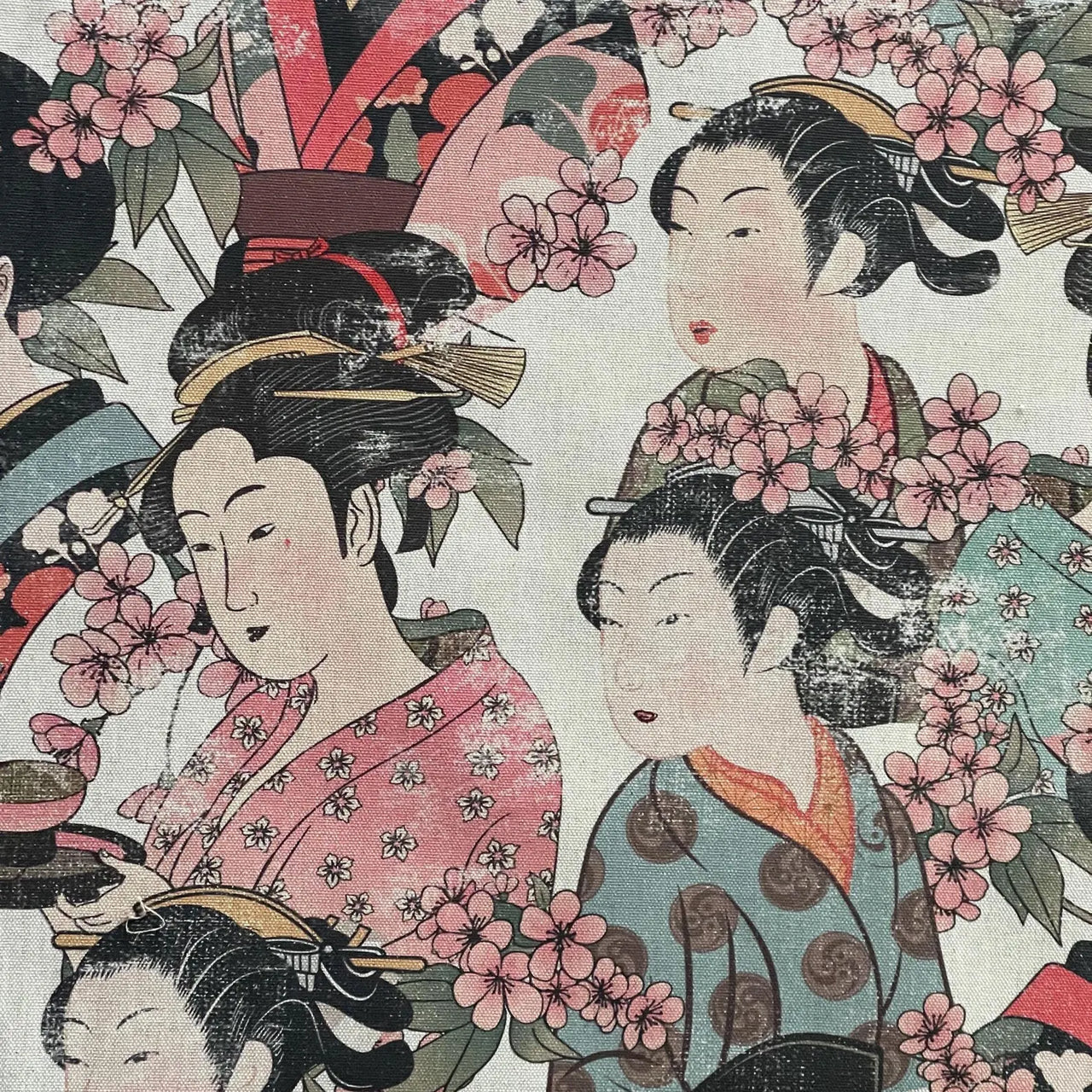 Close-up of elegant geisha illustrations on 100% cotton fabric with pink cherry blossom accents.