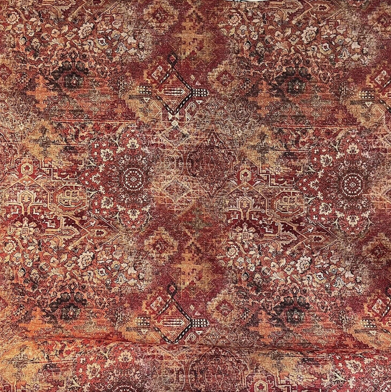 Rustic kilim-style tapestry fabric in red, terracotta, and green tones with intricate oriental vintage pattern – full fabric view

