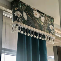 Thumbnail for Decorative air conditioner cover with floral pattern and tassels on a window.