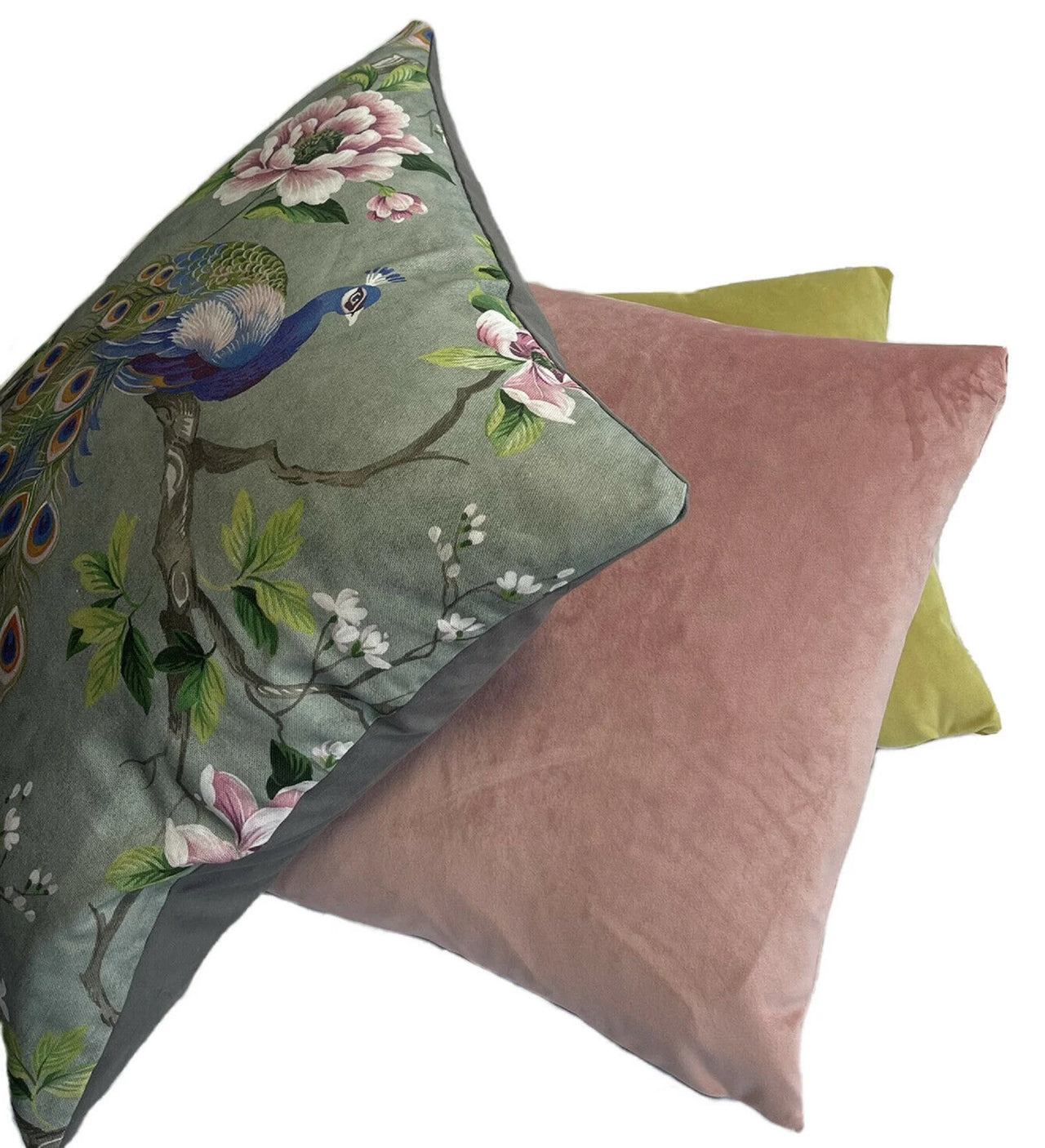 Peacock tail print pillow with vintage floral details.


