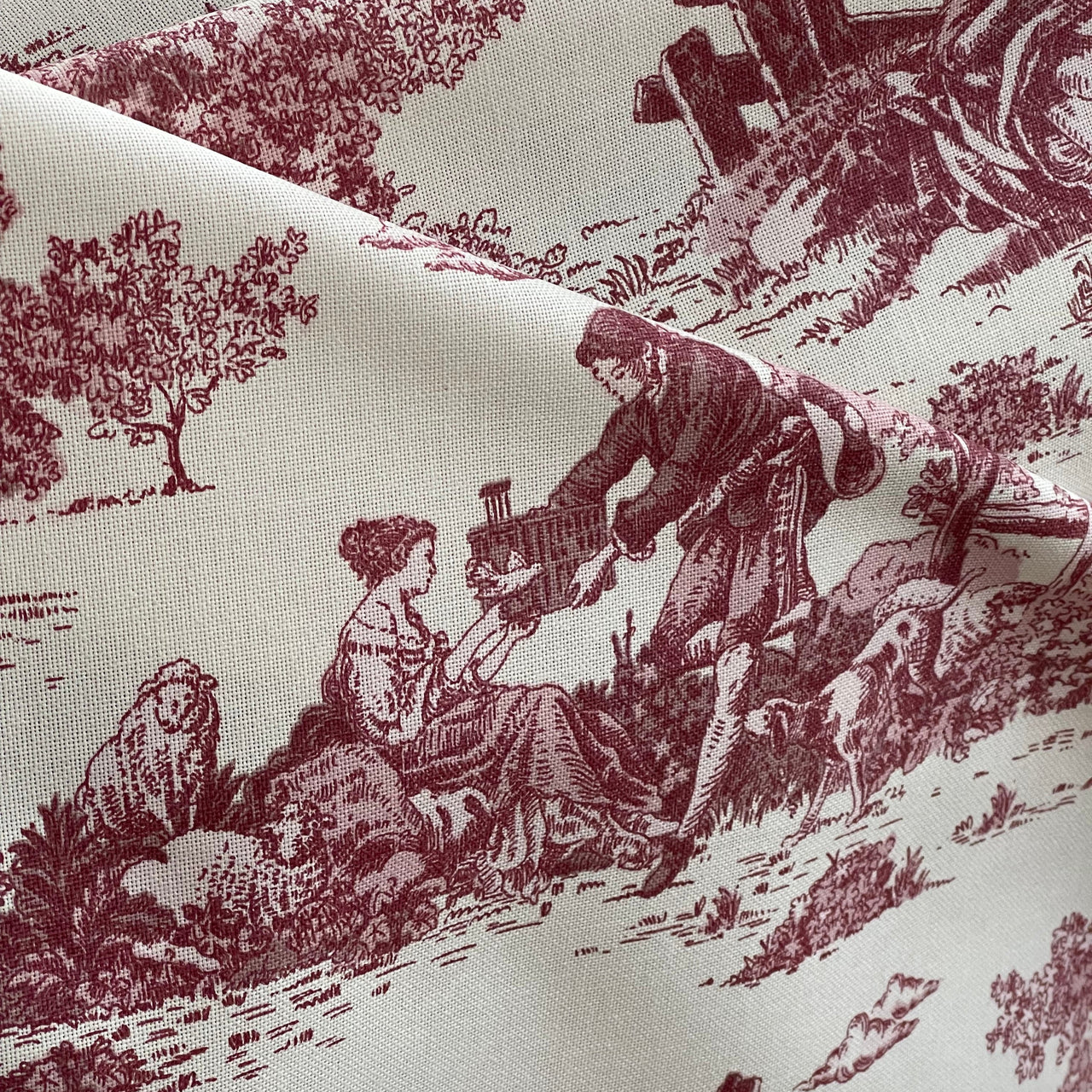 Red Toile de Jouy cotton fabric with French countryside scene