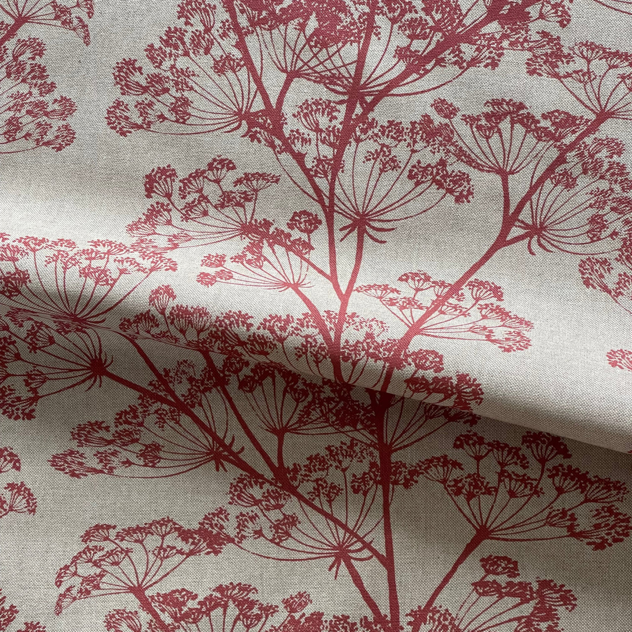 Linen texture fabric with red floral sprig pattern for interiors