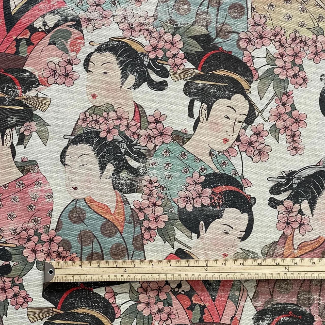 Traditional Japanese design with geisha figures and cherry blossoms, featuring a ruler for scale.