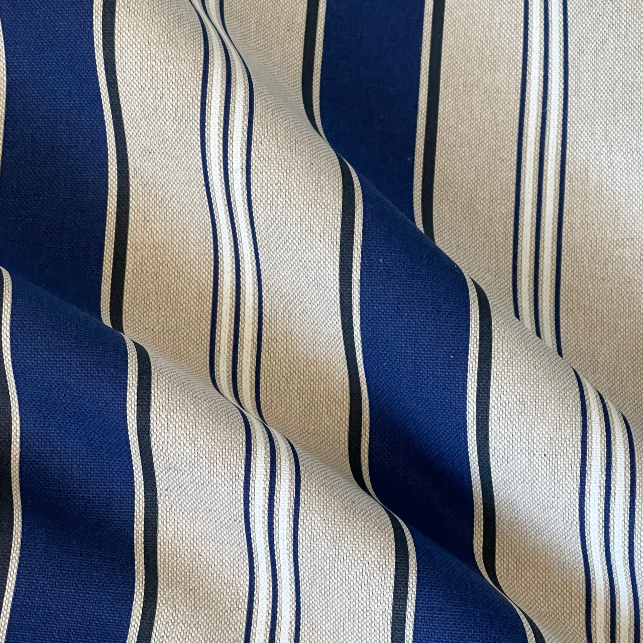 Detailed view of the woven texture of Riviera blue striped furnishing fabric