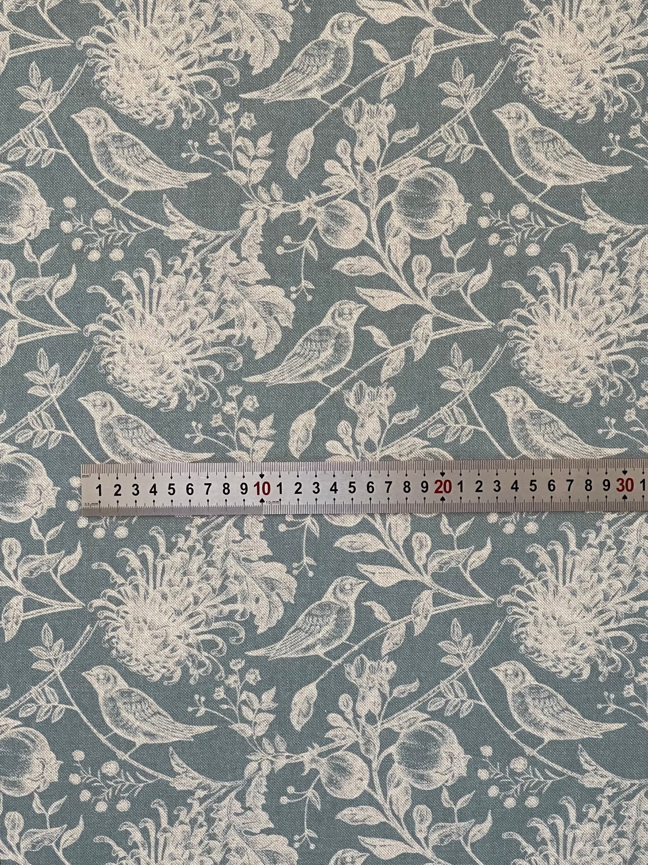 Folded robin and flower print cotton fabric