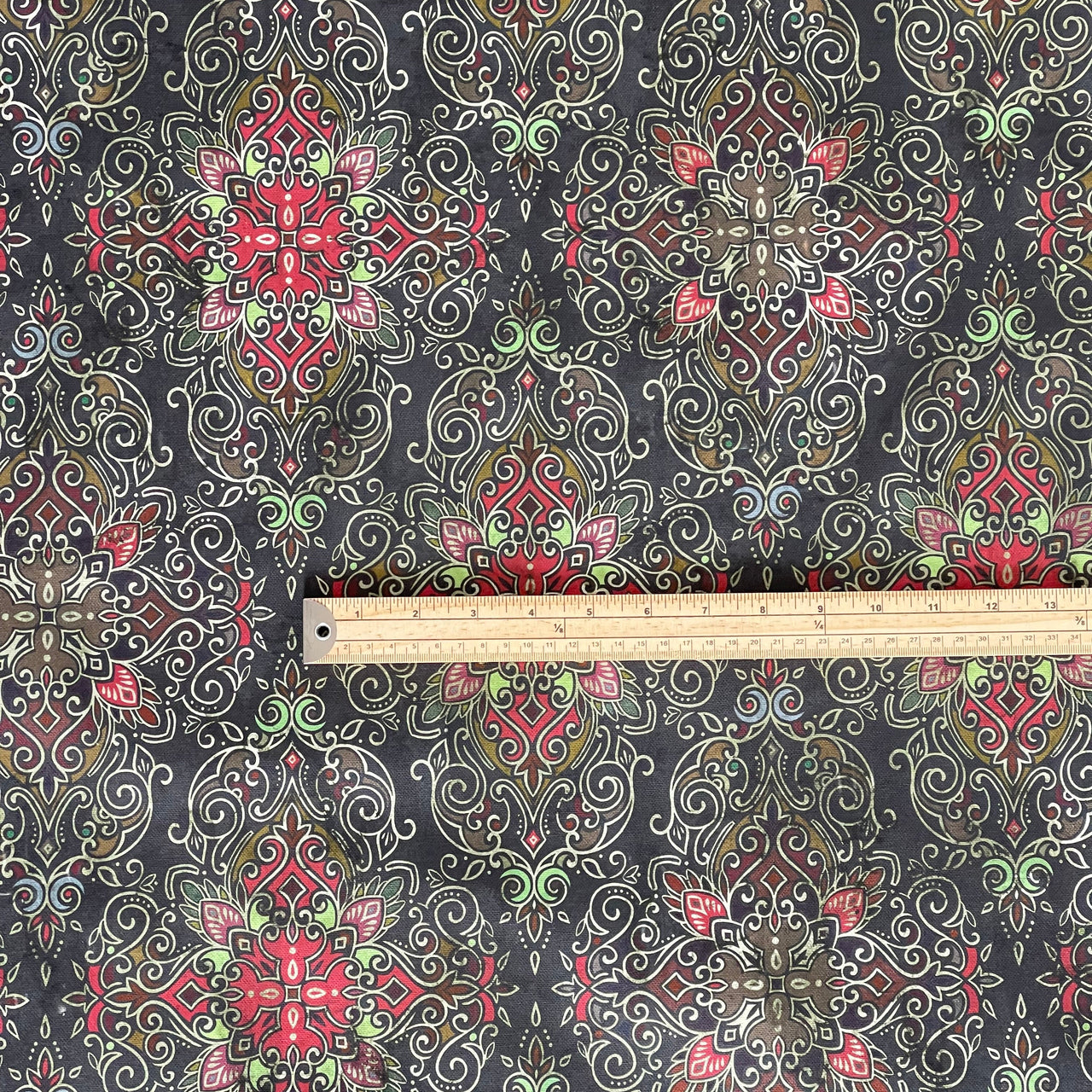 Dark bohemian textile with red geometric kilim motifs