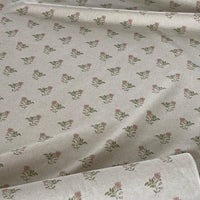 Thumbnail for Floral patterned fabric with small flowers and leaves on a light background