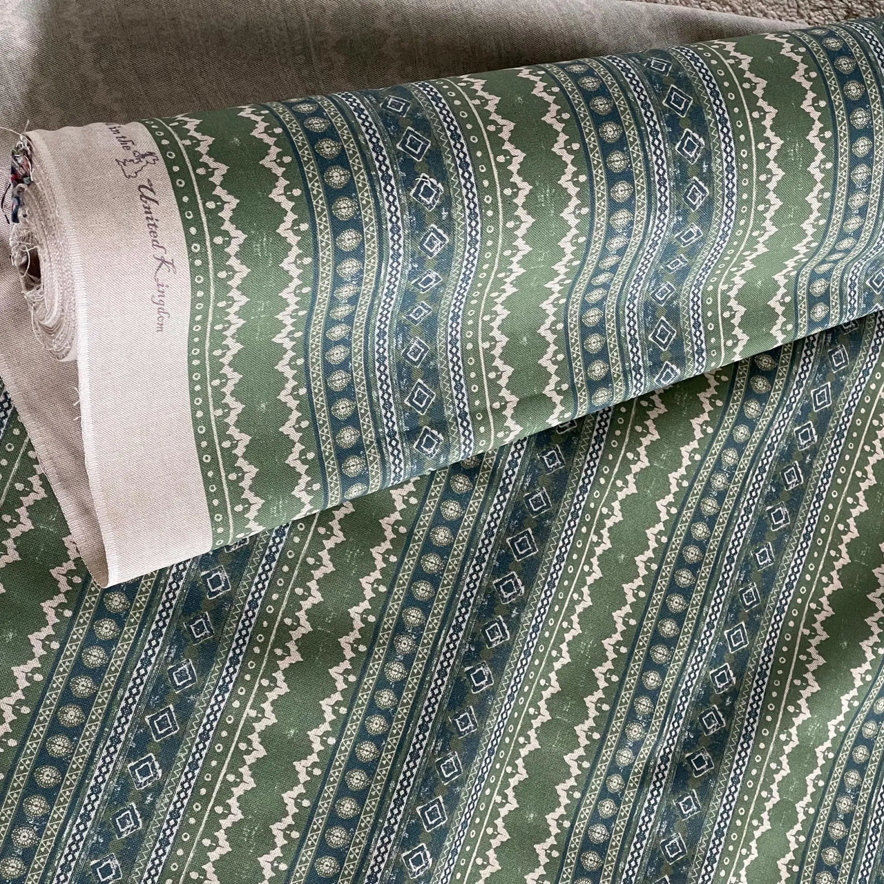 Sage Country fabric roll in green and blue tribal stripe pattern – medium-weight cotton ideal for custom curtains, blinds, cushions, and home decor projects
