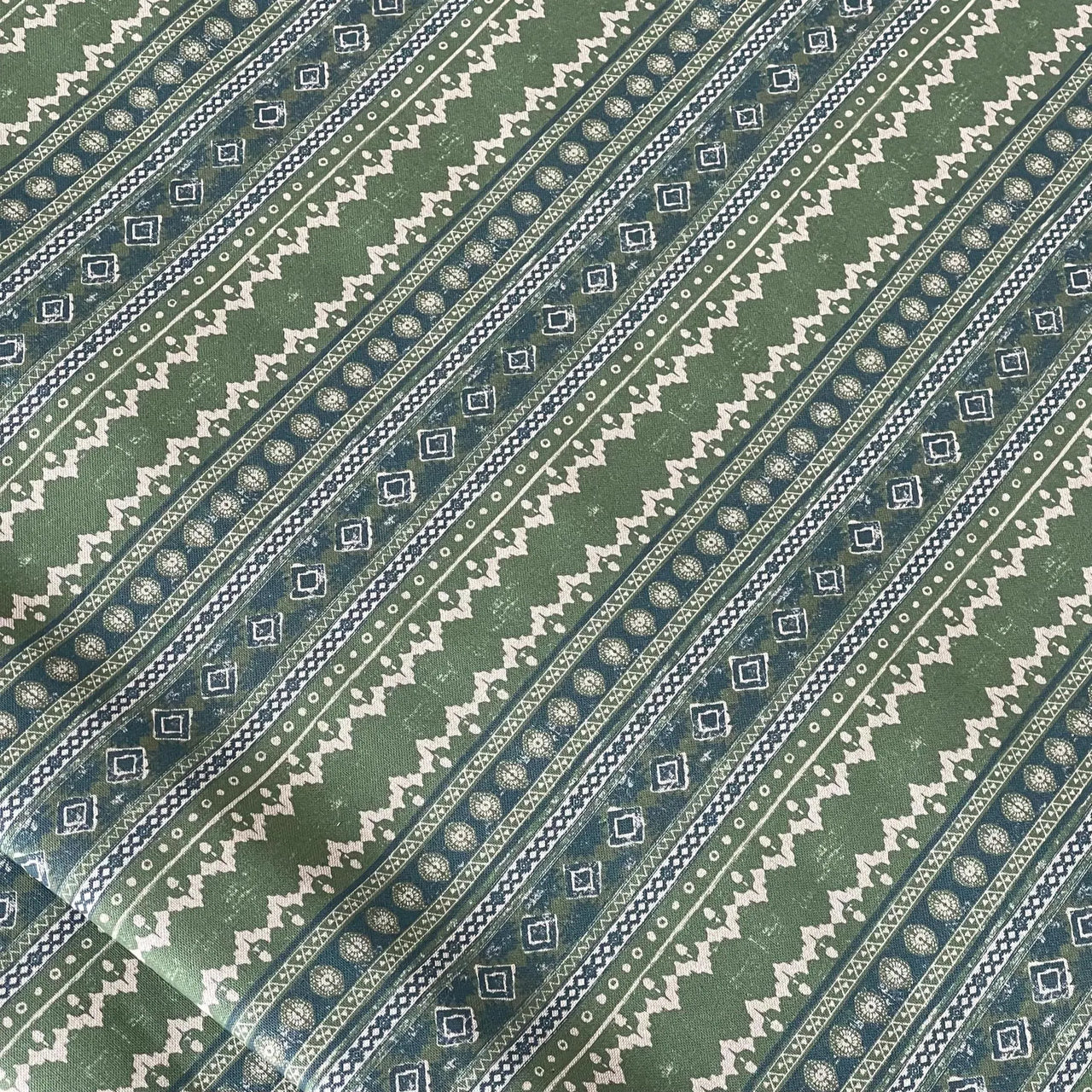 Sage green cotton fabric with tribal diamond stripe pattern – perfect for cottage-style blinds, custom soft furnishings, or rustic interior projects
