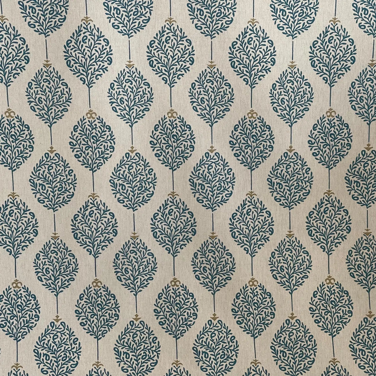 Teal leaf patterned fabric suitable for cushions and light upholstery