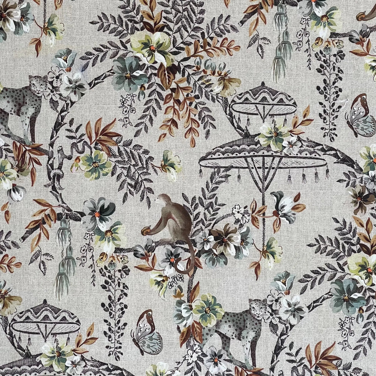 Flat view of Savannah jungle fabric with cheetah, monkey, parasol, and butterflies — a bold nature-inspired textile for modern interiors.