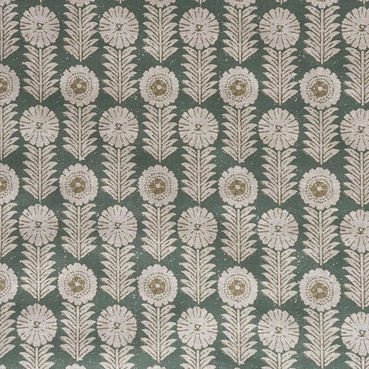 Apple green patterned fabric with stylised floral motifs and leaf details