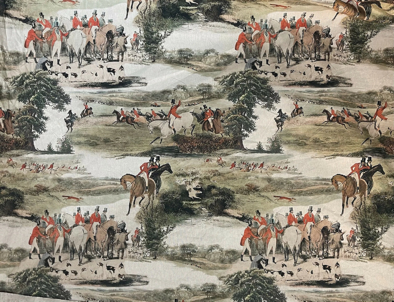 Cotton with a hunting scene with people on horseback and dogs in a natural landscape.