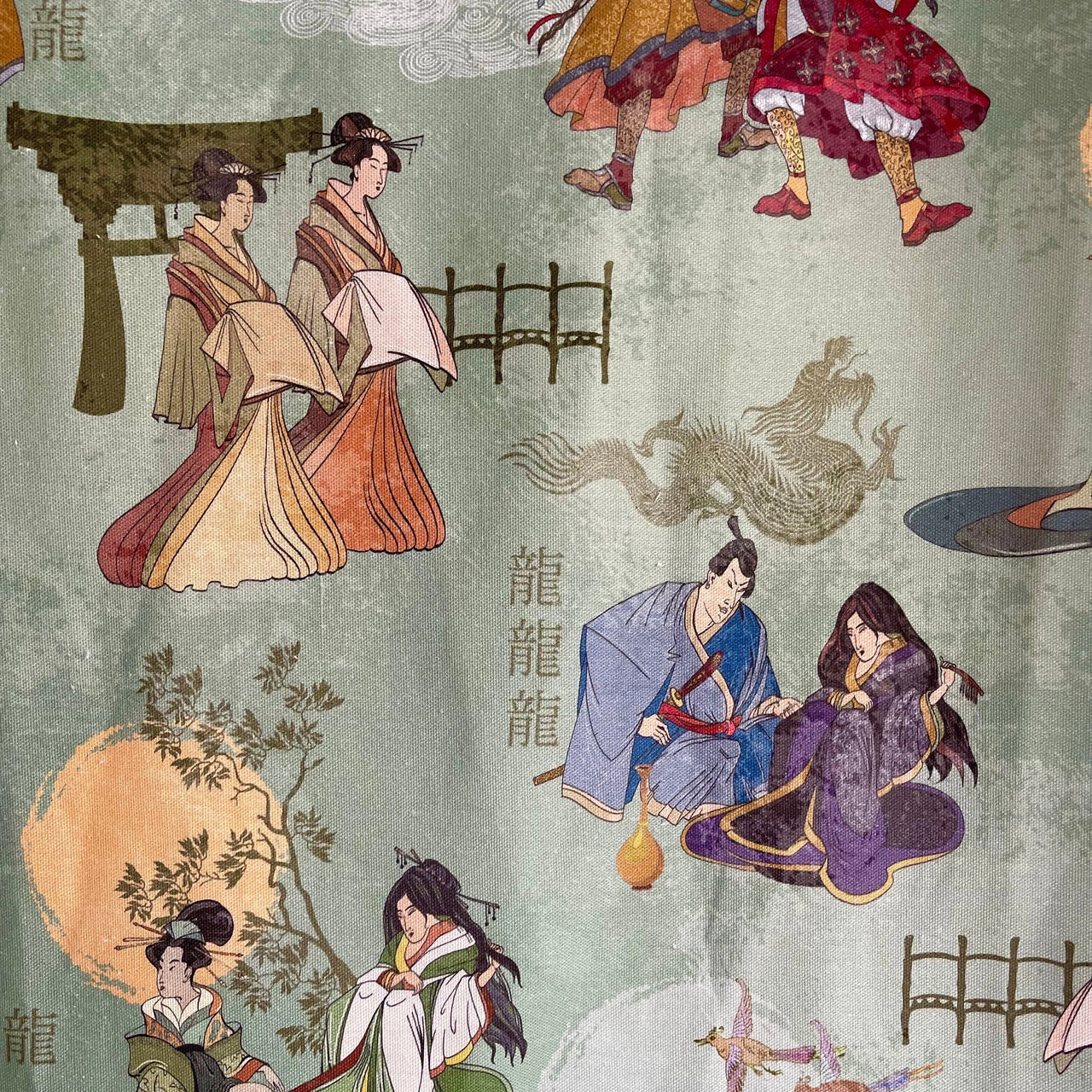Green fabric with hand-painted traditional Asian figures