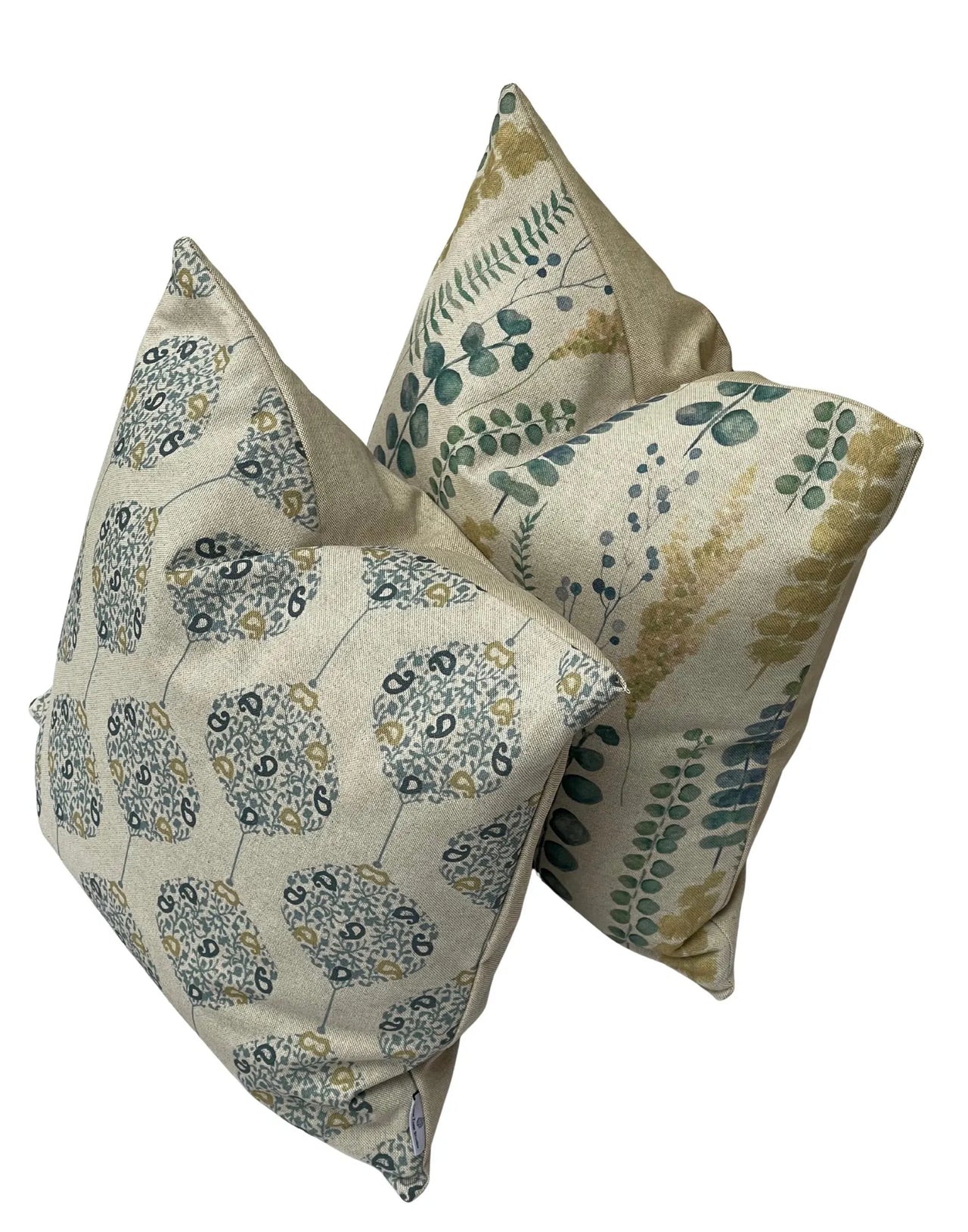 Botanical and geometric cushion set in matching earthy green and teal colour palette.
