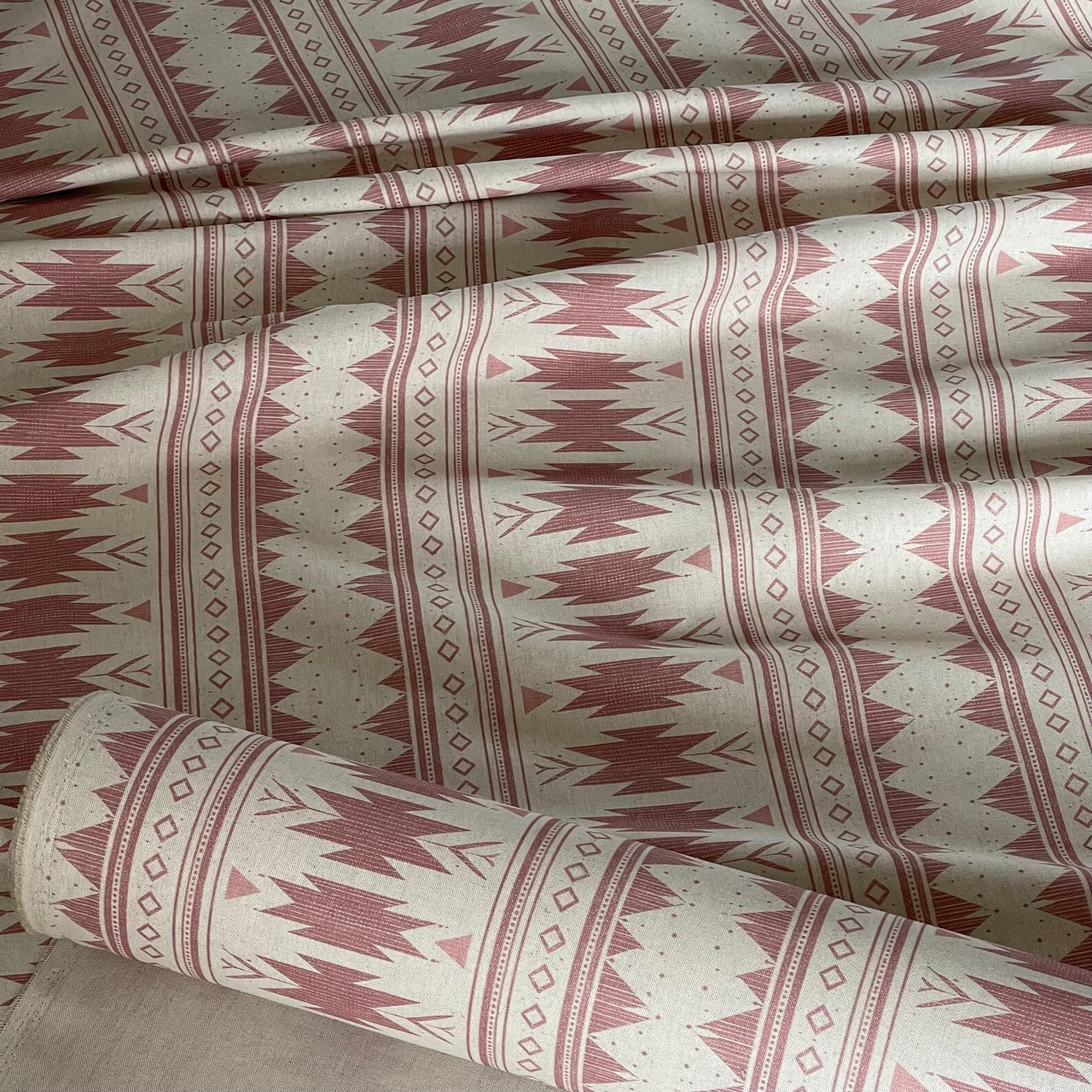 Blush pink Aztec fabric with Southwestern tribal geometric pattern on linen look base