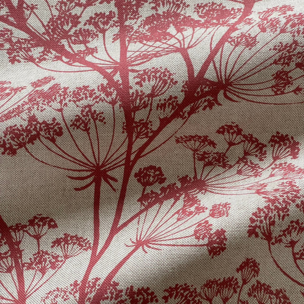 Red cow parsley fabric with botanical floral print on natural linen look background
