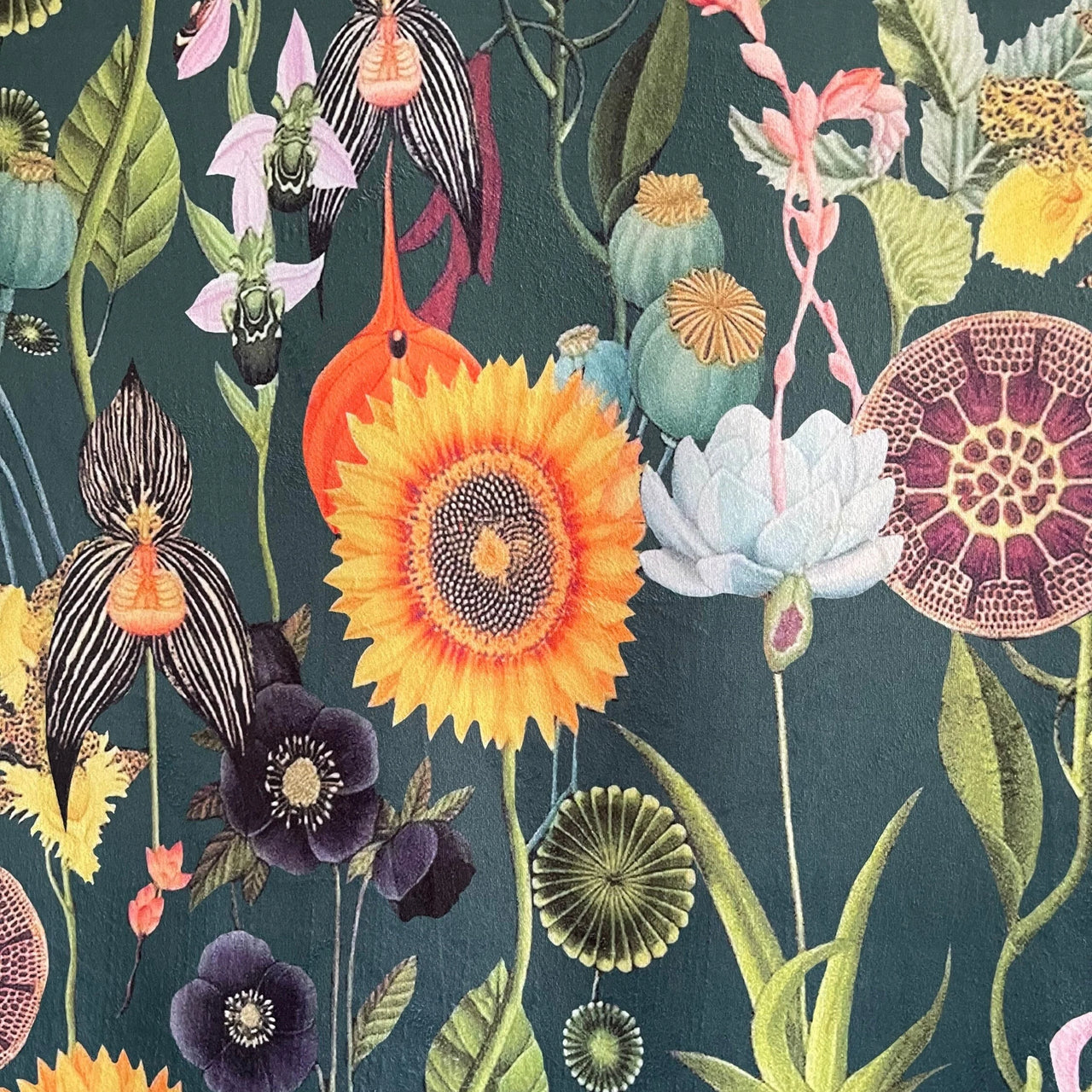 Colorful floral and insect pattern on a dark green background