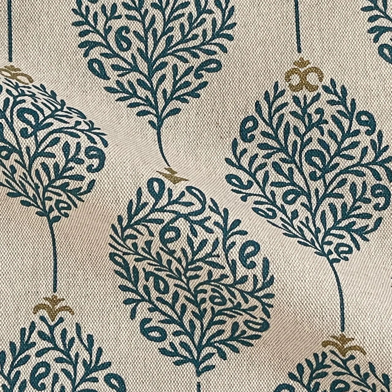 Nature inspired botanical fabric with teal foliage on neutral background