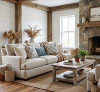 Thumbnail for Teal botanical leaf cushion covers styled on a neutral sofa in a bright country farmhouse living room.