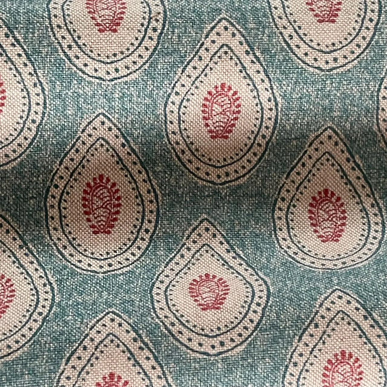Teal teardrop paisley fabric with Indian buta motif on linen look background